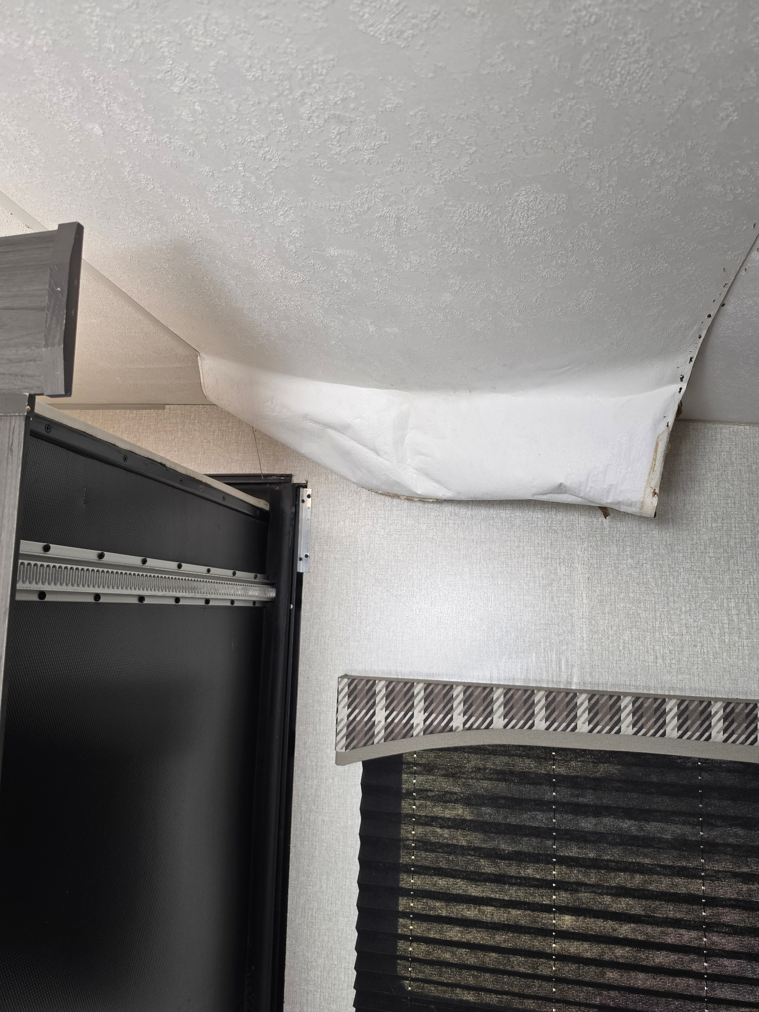 Close view of sagging and detached ceiling material